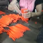 Workers assembling pens